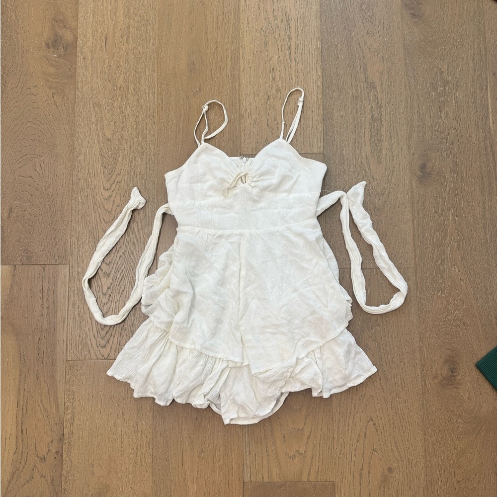 White Sleeveless Romper with Ruffle Hem